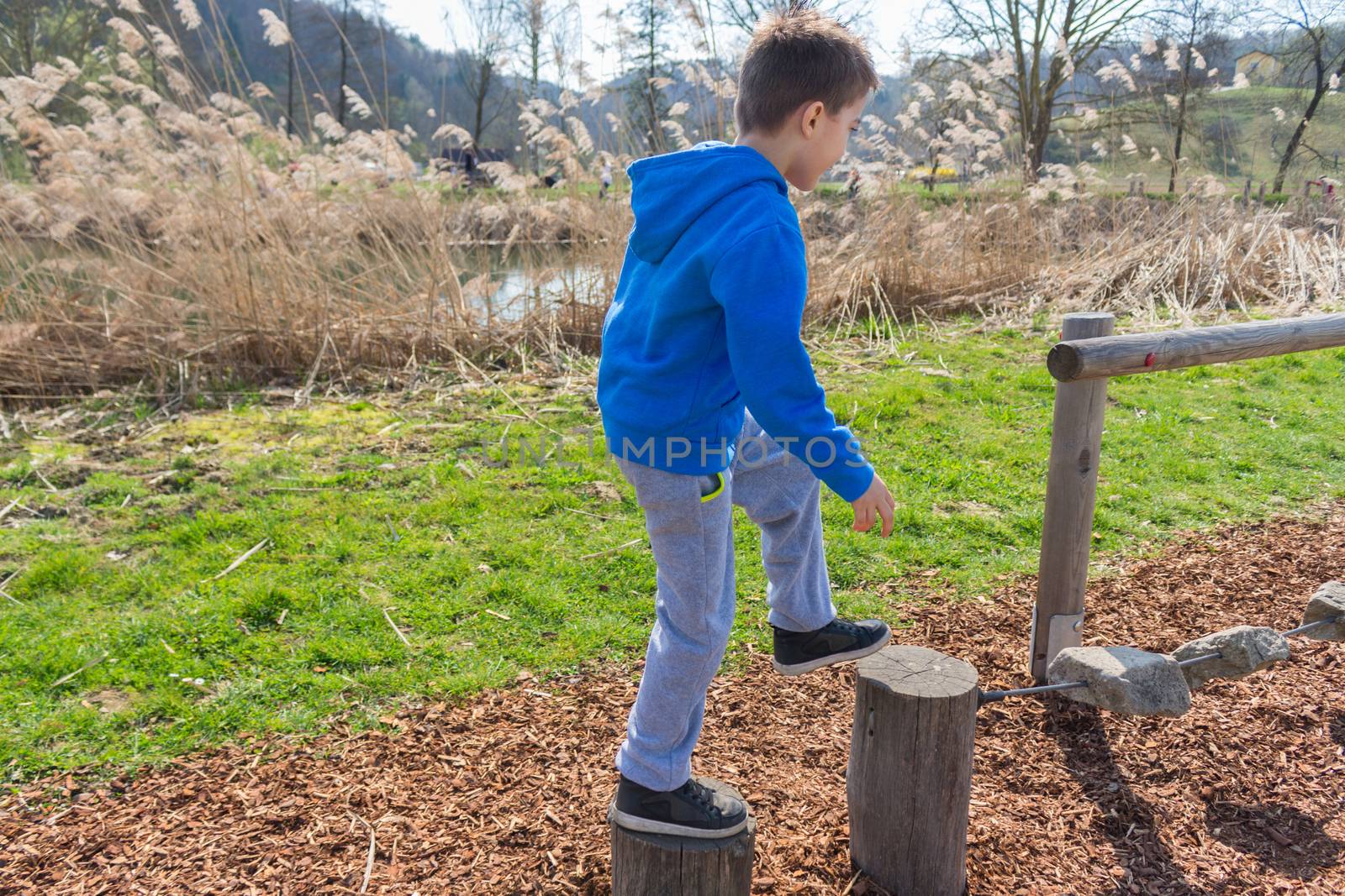 Young boy climbing on playground