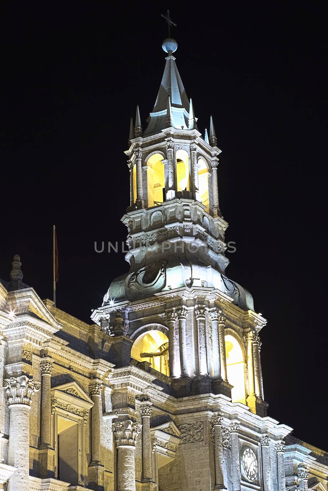 The steeple of the Basilica Cathedral on Plaza de Armas in Arequipa in Southern Peru photographed at night. The historic city center of Arequipa is an UNESCO World Cultural Heritage Site. 