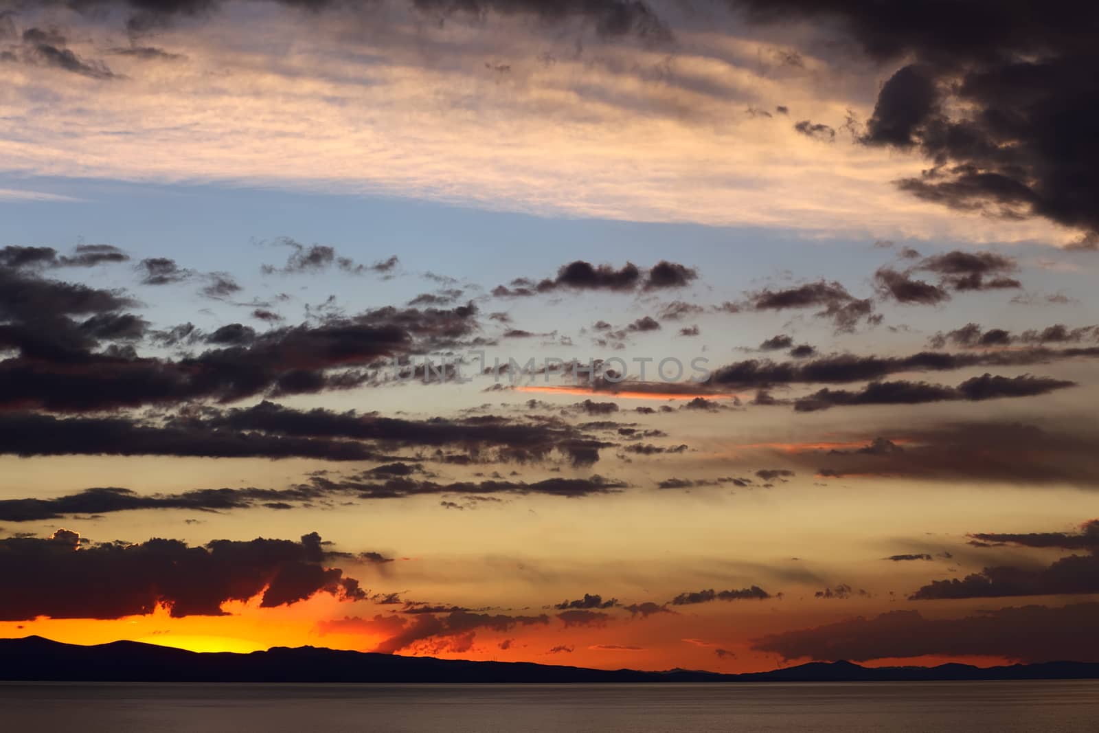 Evening Sky with Clouds Over Lake Titicaca in Bolivia by sven