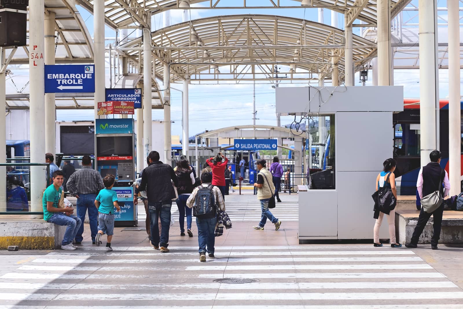 QUITO, ECUADOR - AUGUST 8, 2014: Unidentified people walking to the boarding area of the local transportation system (trole bus, ecovia, metro bus) at the Terminal Terrestre Quitumbe (long-distance bus terminal) on August 8, 2014 in Quito, Ecuador