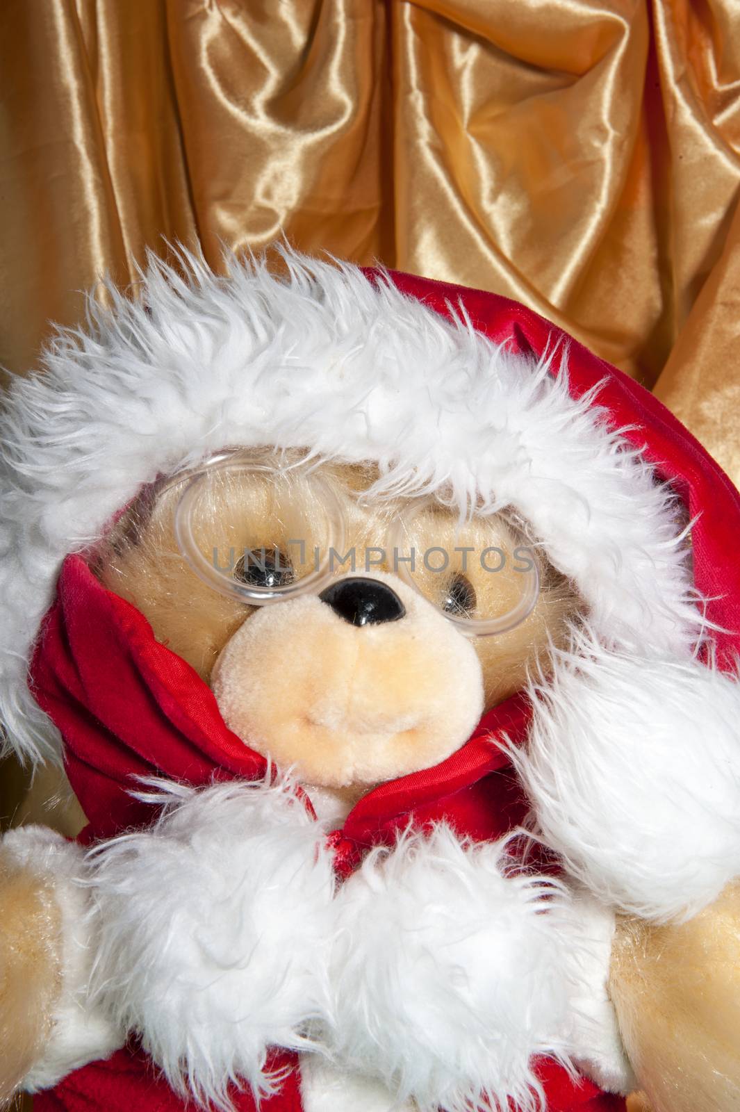 a doll with hat of santa claus and gifts