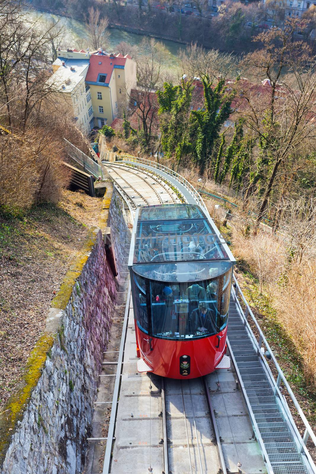 Graz, Austria - January 16, 2011:  Modern funicular climbing to Schlossberg and Graz city panoramic view, Austria