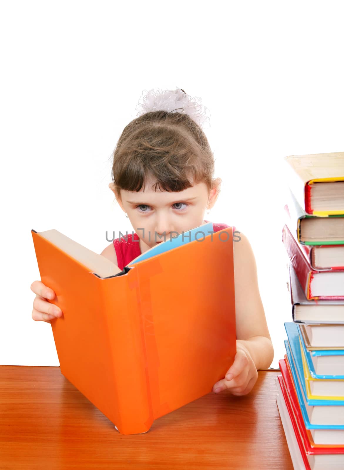 Little Girl with the Books at the Desk on the White Background