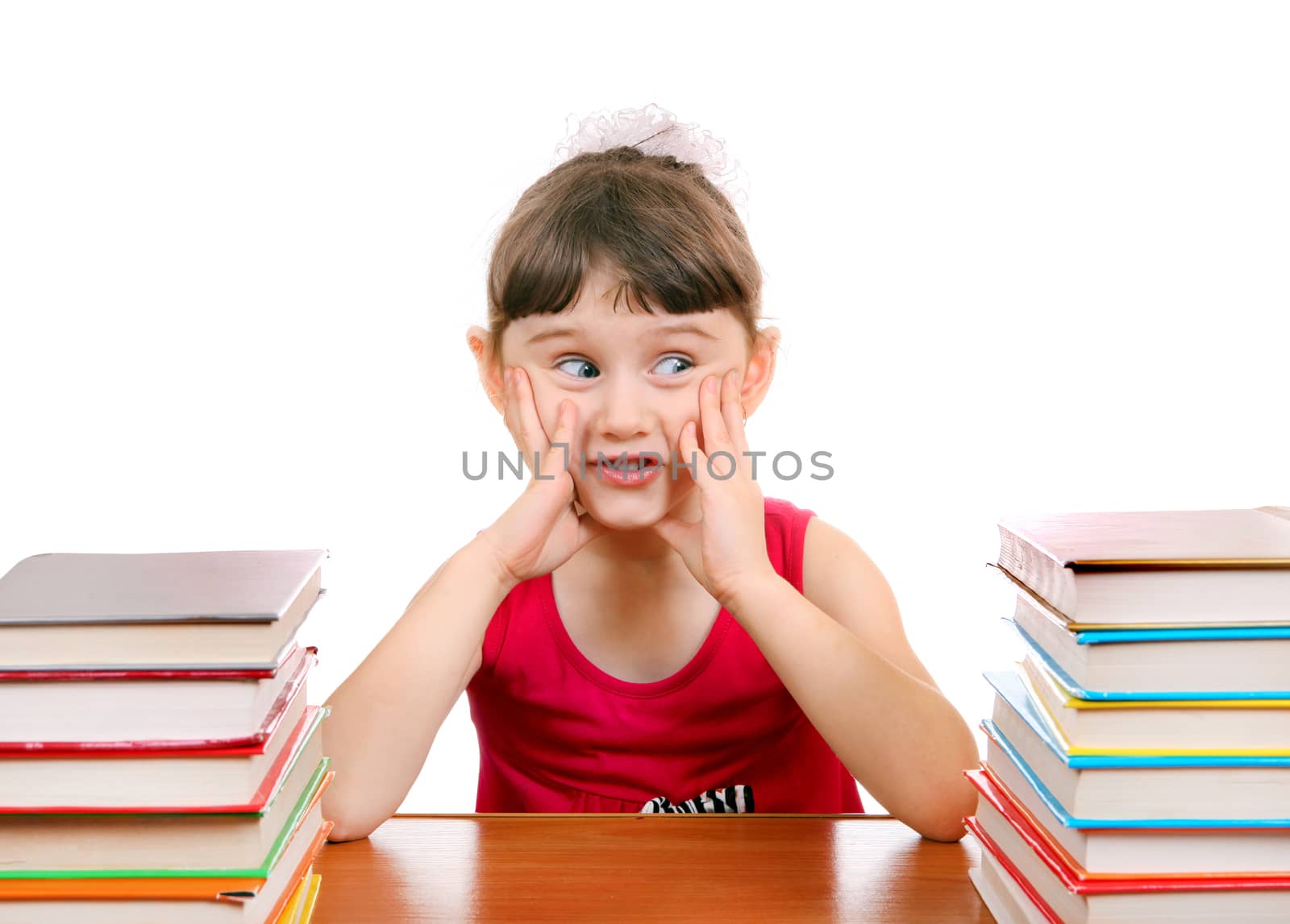 Little Girl with the Books at the Desk on the White Background