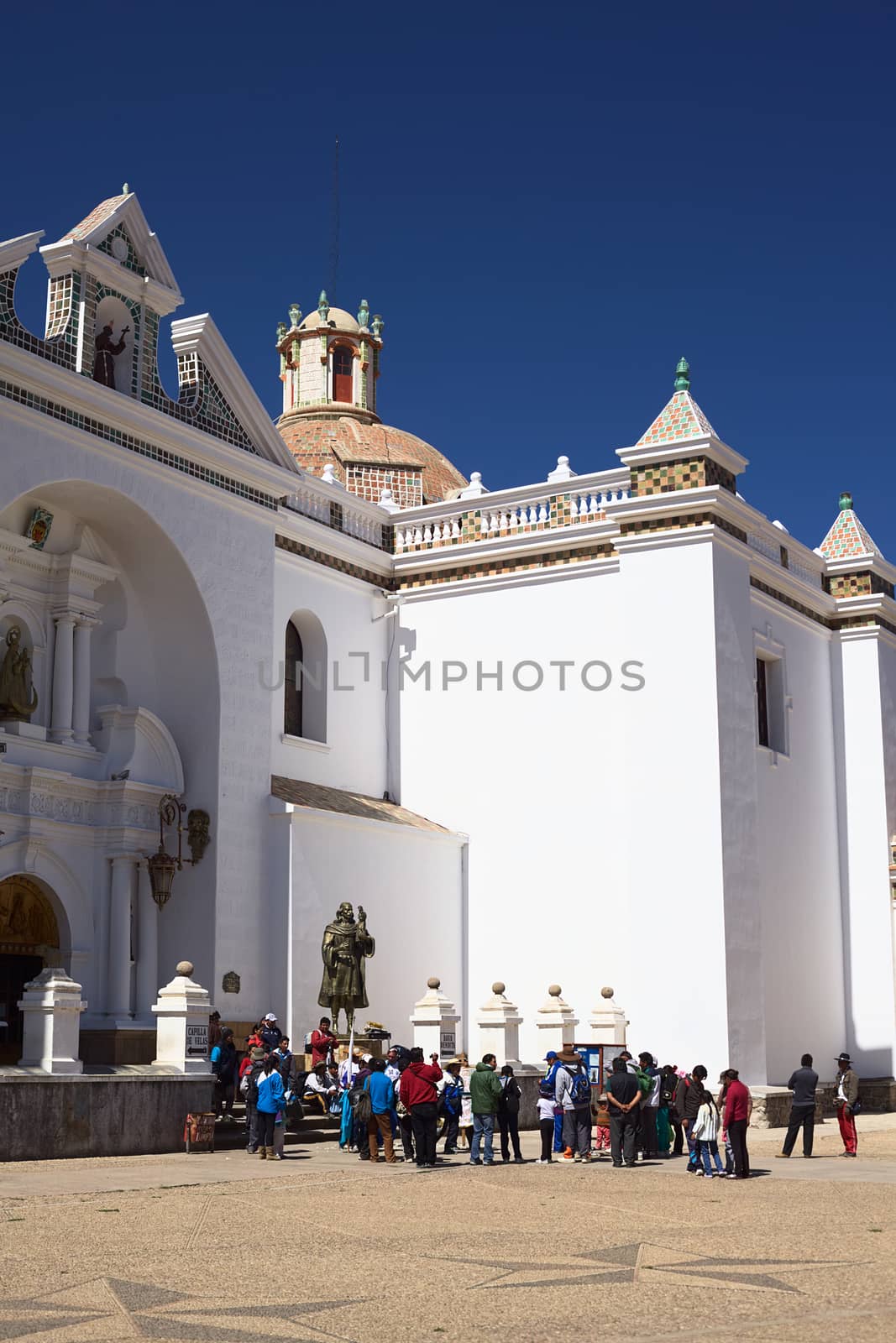 COPACABANA, BOLIVIA - OCTOBER 18, 2014: Unidentified people at the entrance of the Basilica of Our Lady of Copacabana in the small tourist town along the Titicaca Lake on October 18, 2014 in Copacabana, Bolivia 