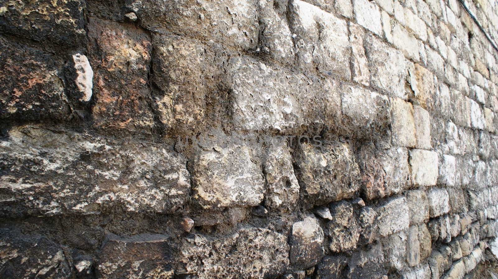 Stone wall in Tarragona, Spain by dormouse_a