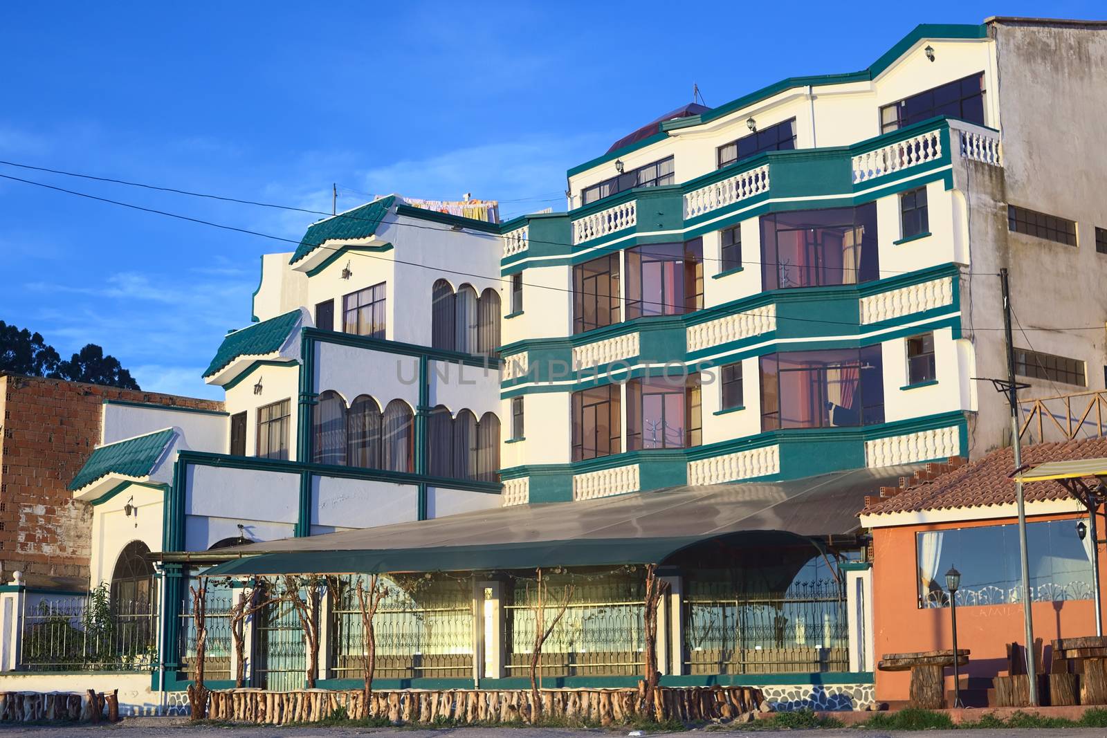 COPACABANA, BOLIVIA - OCTOBER 17, 2014: Hotel Residencial Brisas del Titicaca on the shore of Lake Titicaca on October 17, 2014 in the small tourist town Copacabana, Bolivia. Boats to Isla del Sol (Sun Island) depart from this town. 