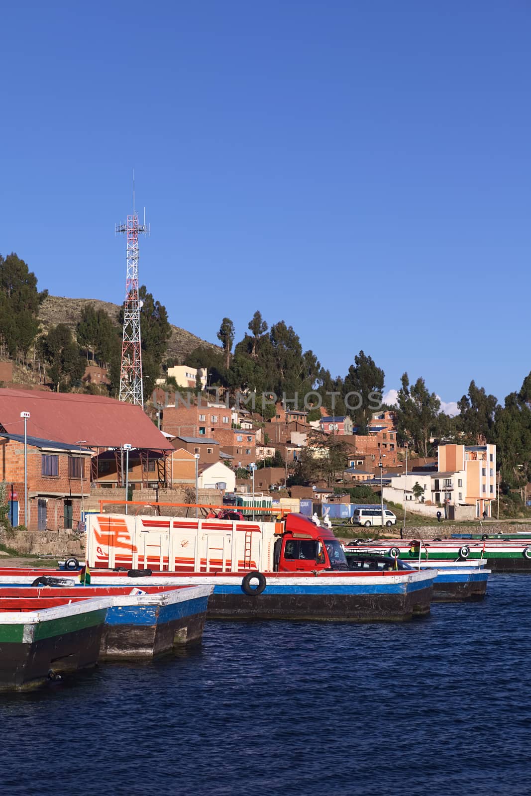 TIQUINA, BOLIVIA - OCTOBER 16, 2014: Truck on wooden ferry waiting to be transported over the Strait of Tiquina at Lake Titicaca on October 16, 2014 in San Pablo de Tiquina, Bolivia