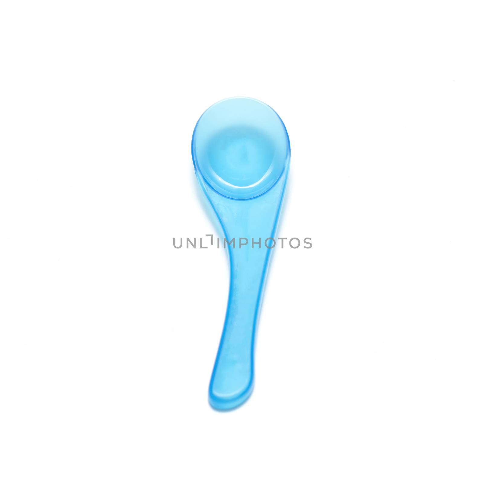 blue plastic spoon on a white background