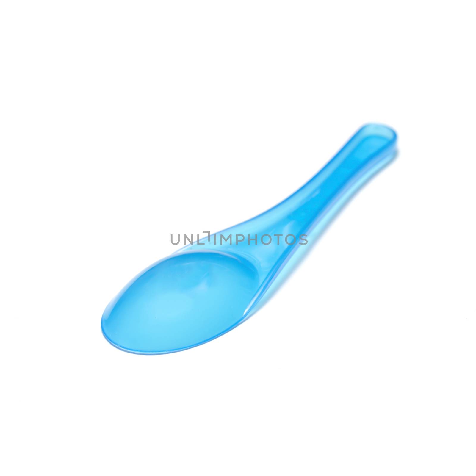 blue plastic spoon on a white background