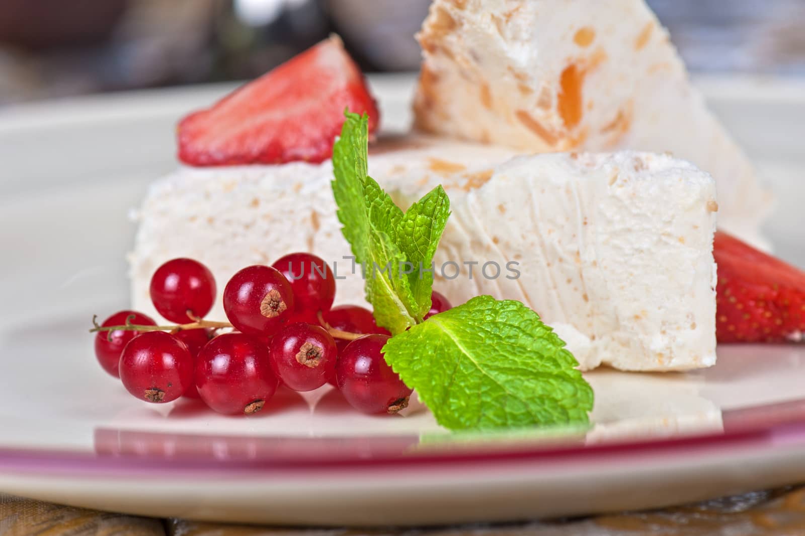 cream dessert with berries cranberries and strawberry