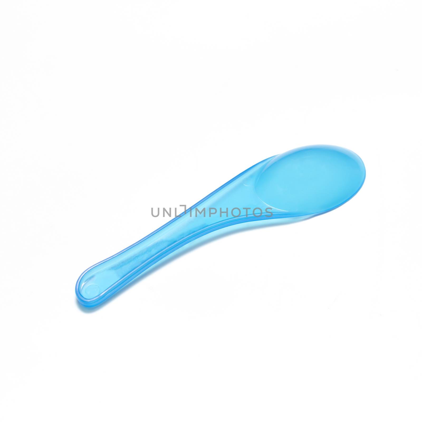 blue plastic spoon on a white background