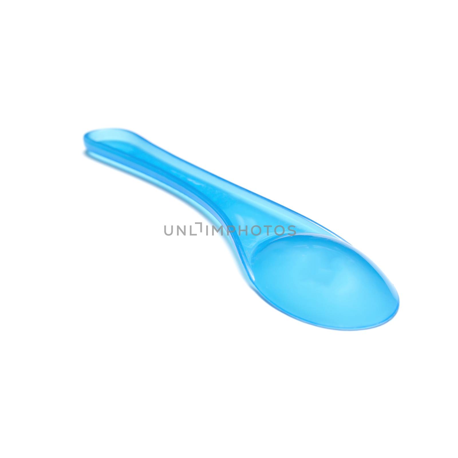 blue plastic spoon on a white background