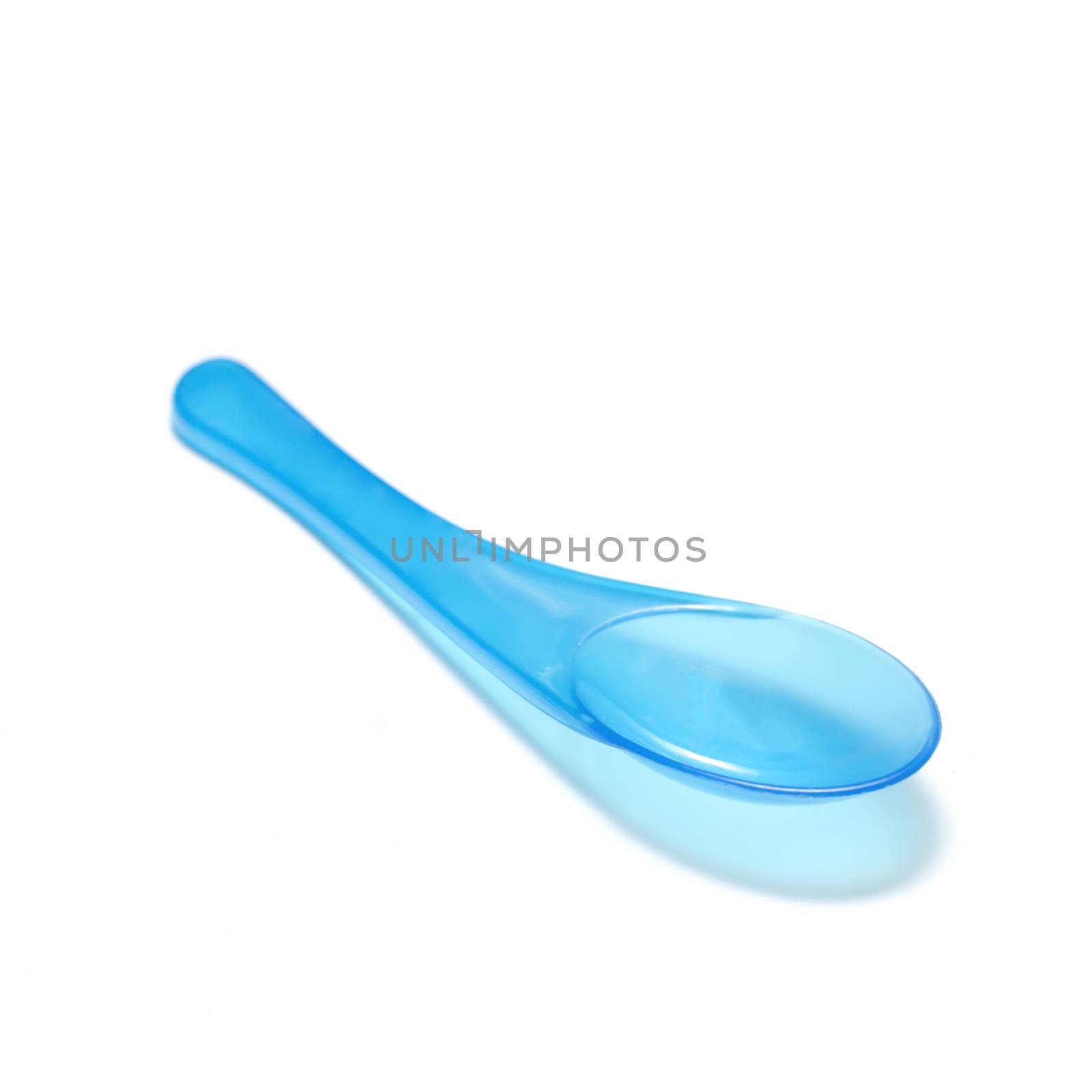 blue plastic spoon on a white background