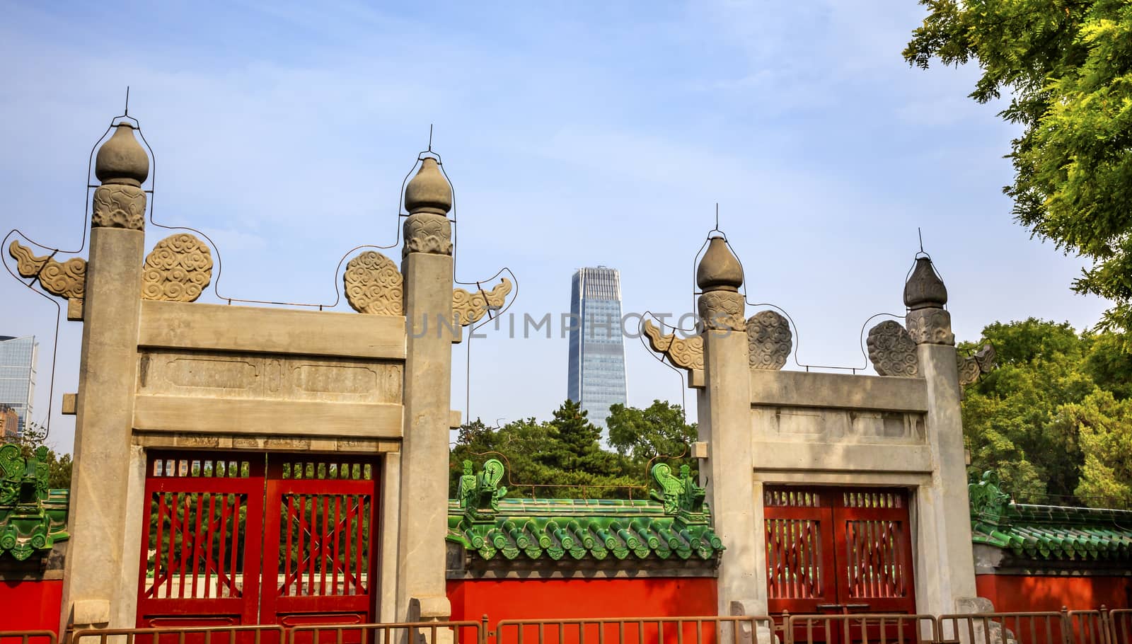 Red Gate, Temple of Sun City Park, Modern Skyscraper Beijing, China Green Trees Entrance to the Oldest Part of the Temple of the Sun where Emperor would do devotions.