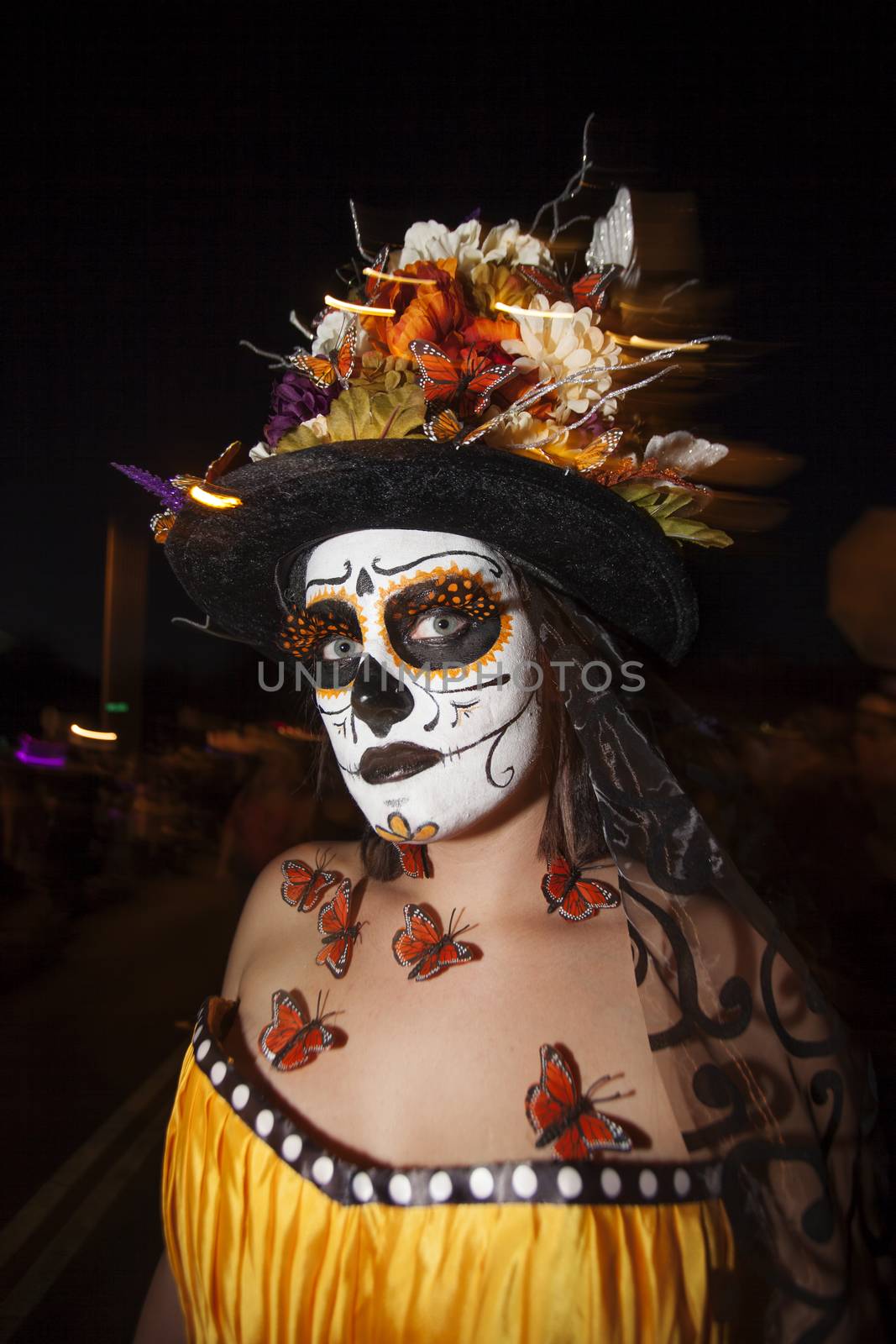 TUCSON, AZ/USA - NOVEMBER 09: Unidentified young woman with facepaint and butterfly adornments at the All Souls Procession on November 09, 2014 in Tucson, AZ, USA.