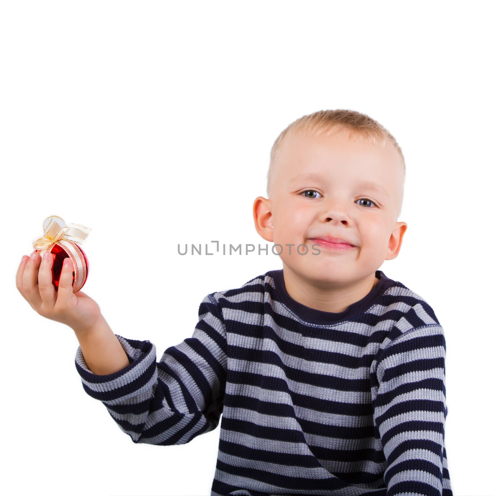 Smiling child with christmas decorations in hand. Isolated on white background