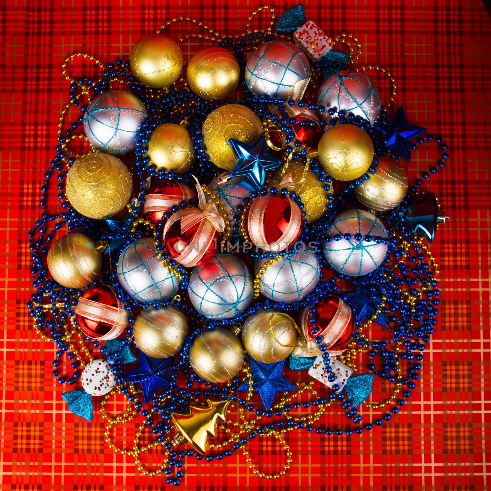 Colored Christmas balls on a red background