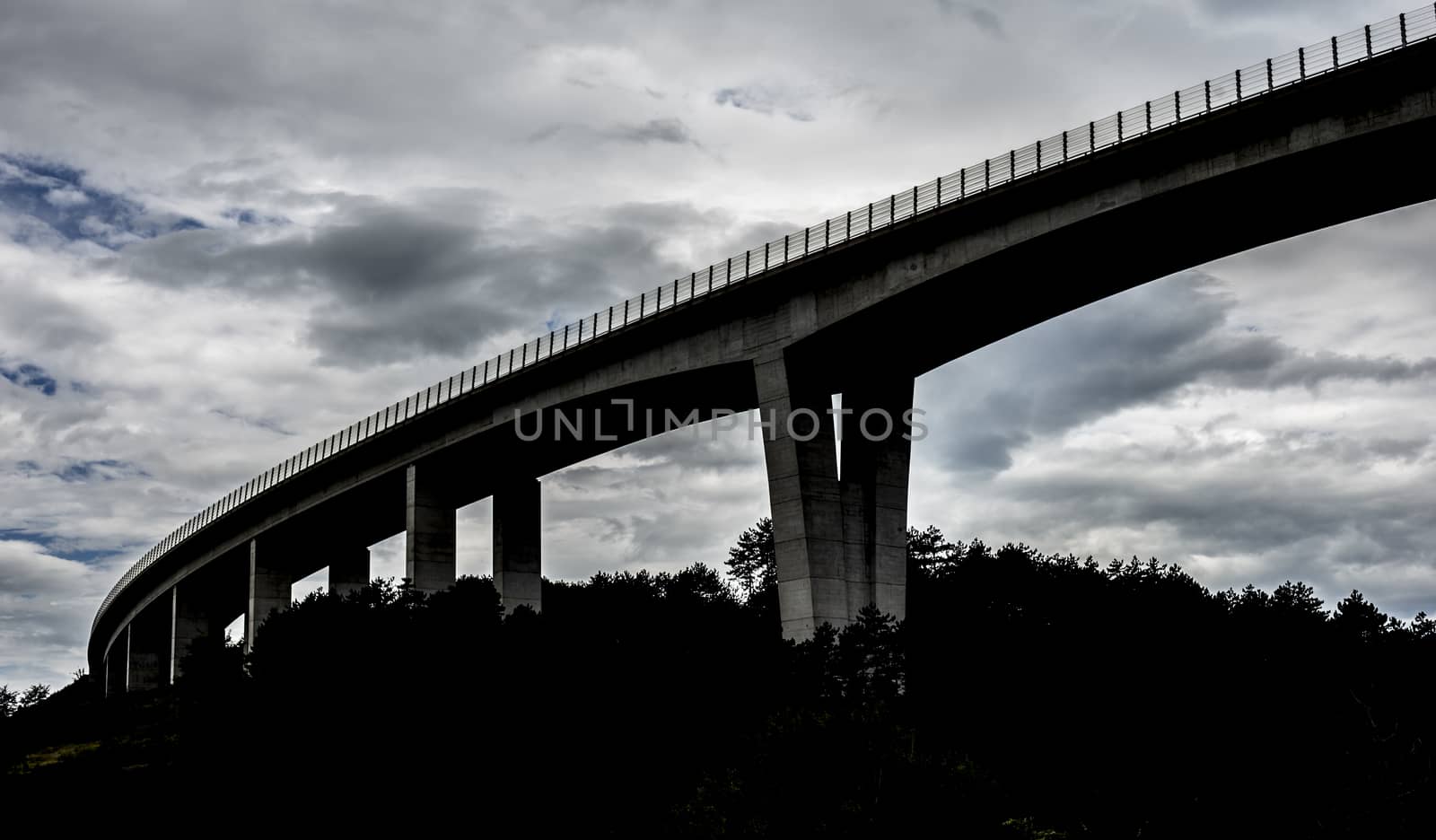 Dark highway overpass by photosampler