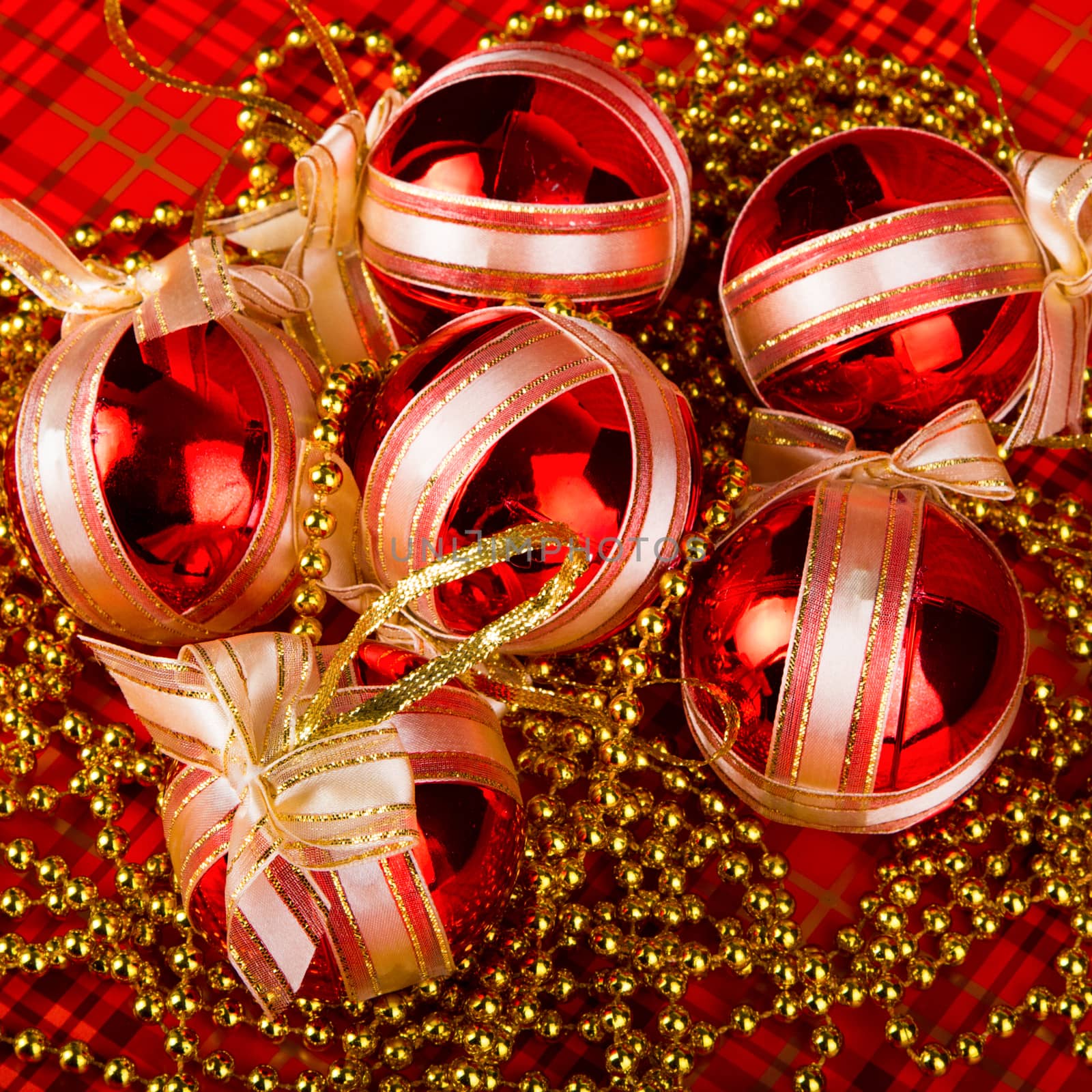 Red Christmas balls on a red background