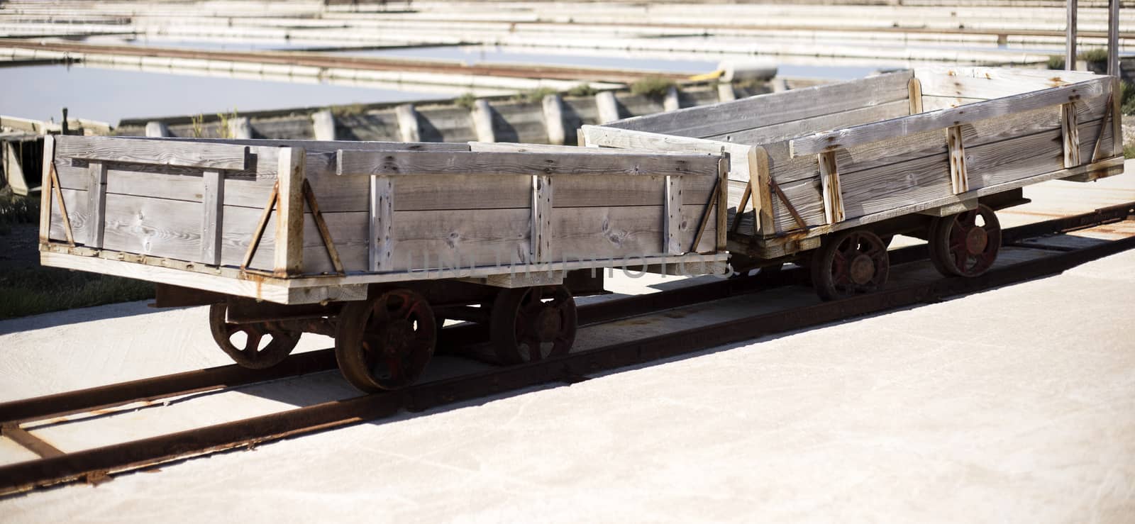 Salt carts on railroad waiting for transport of salt.