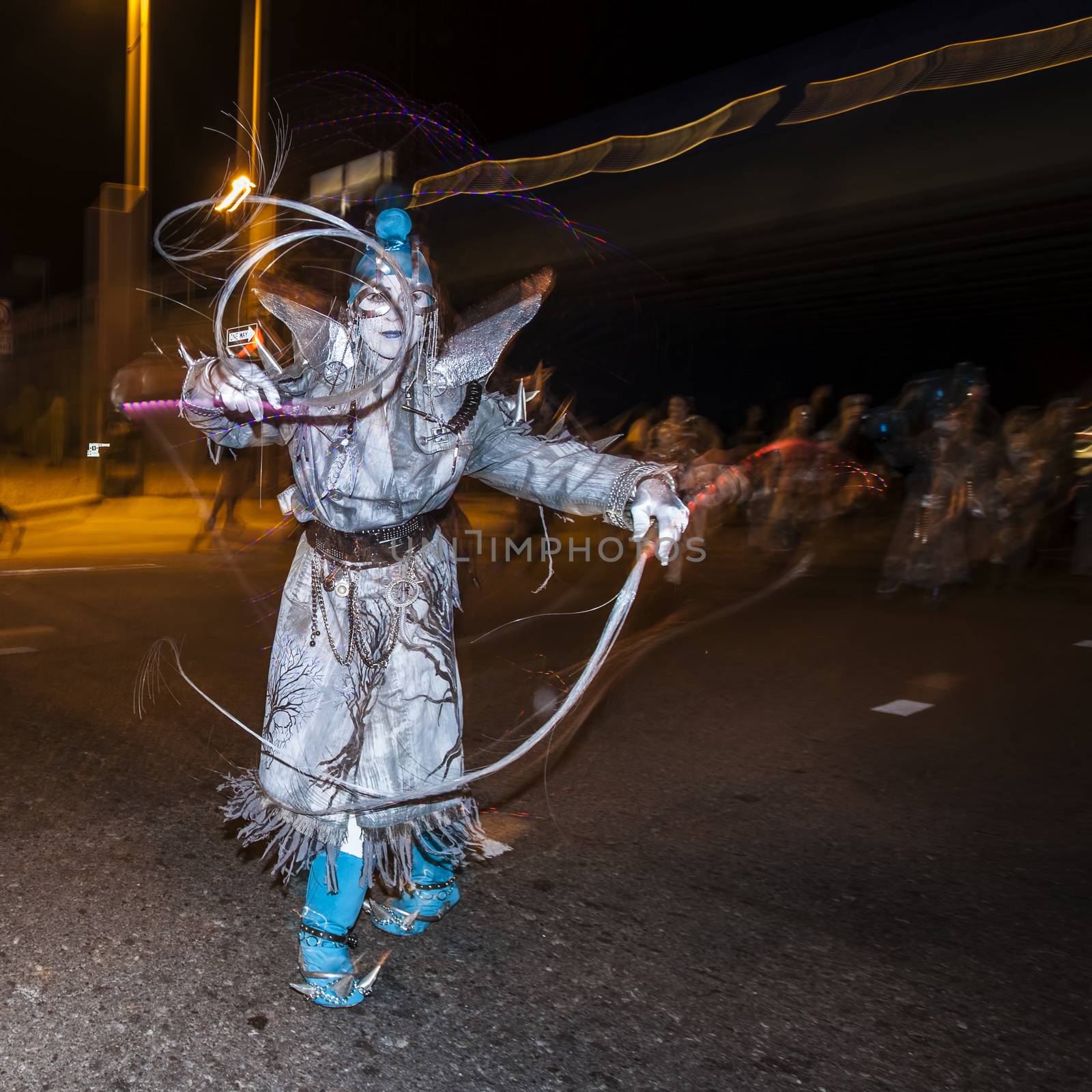 Street Performer in Silver at Dia De Los Muertos Procession by Creatista