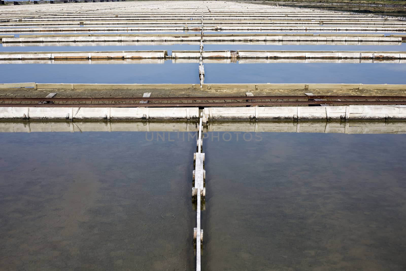 Salt farm water tanks by photosampler