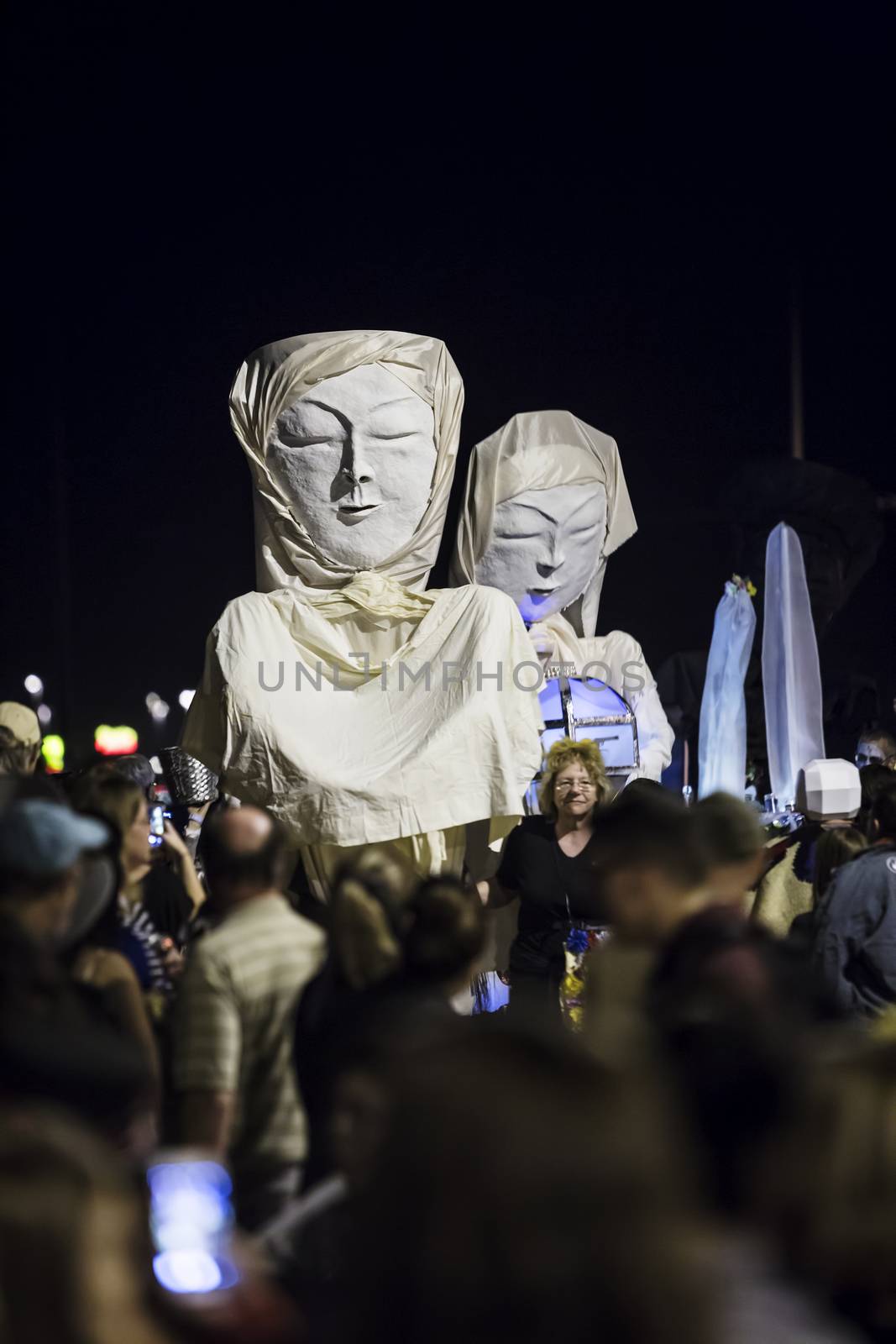 TUCSON, AZ/USA - NOVEMBER 09: Unidentified people with large asian faces in the All Souls Procession on November 09, 2014 in Tucson, AZ, USA.