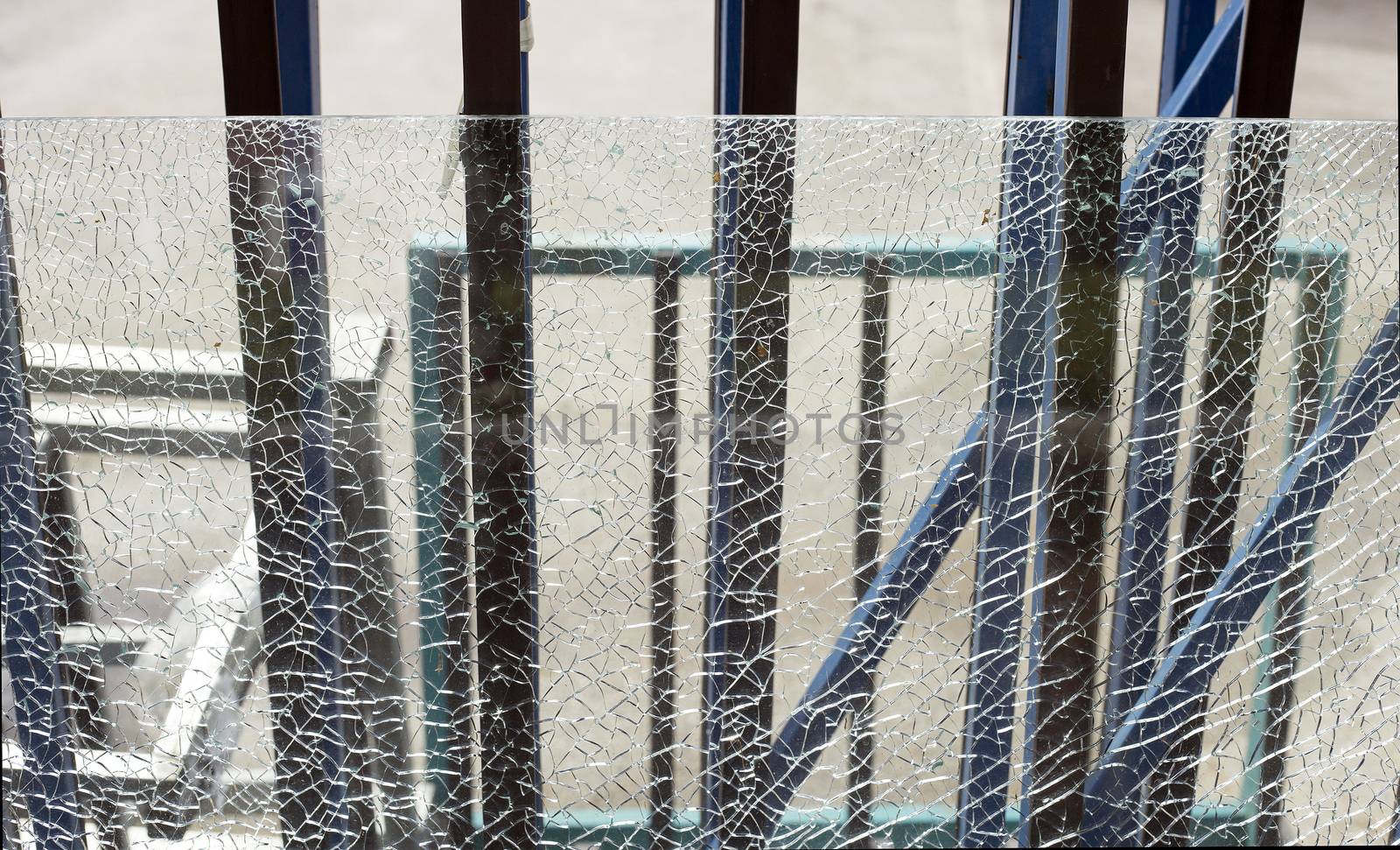 Broken safety glass on a metal frame.