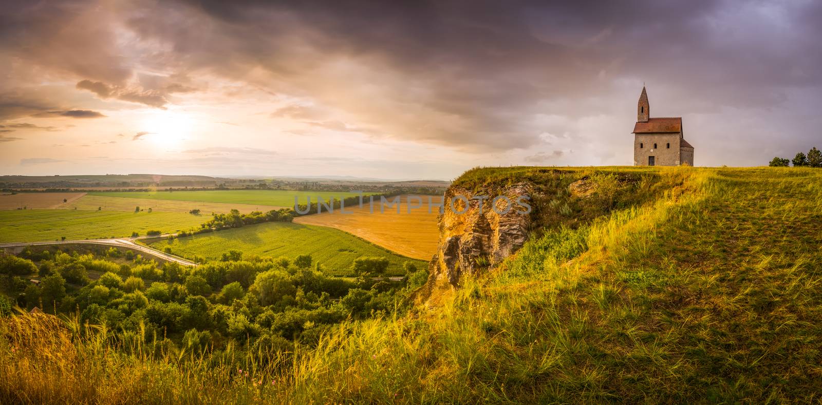 Old Roman Catholic Church of St. Michael the Archangel on the Hill at Sunset in Drazovce, Slovakia