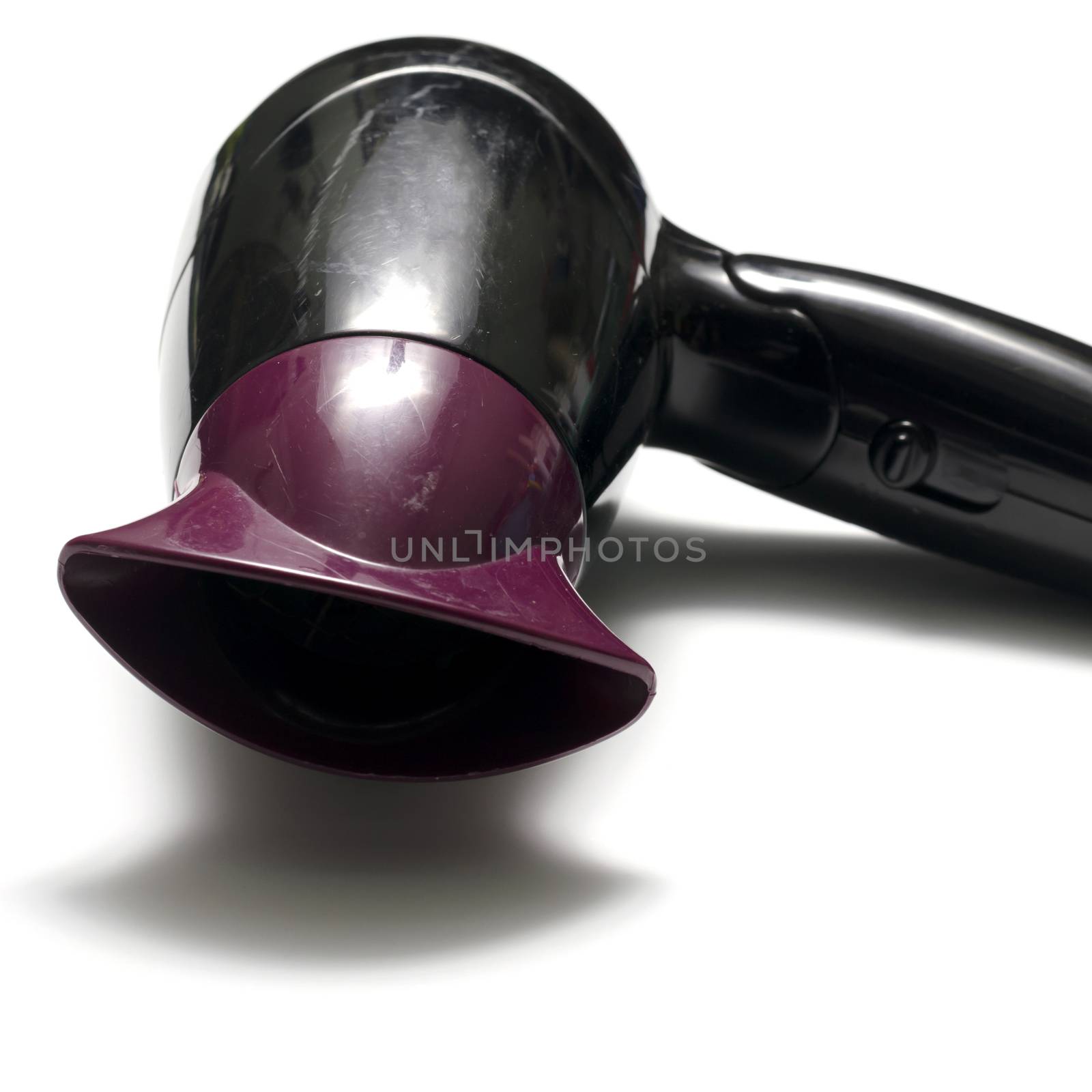 old used electric hair dryer on a white background