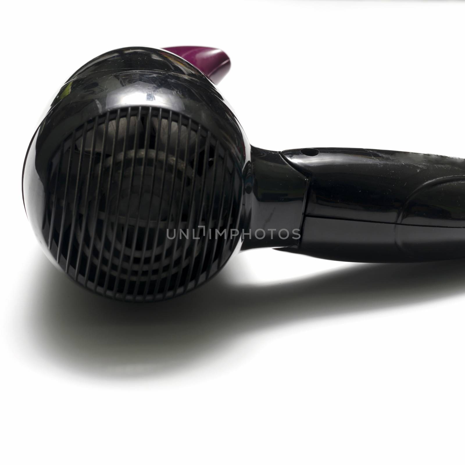 old used electric hair dryer on a white background