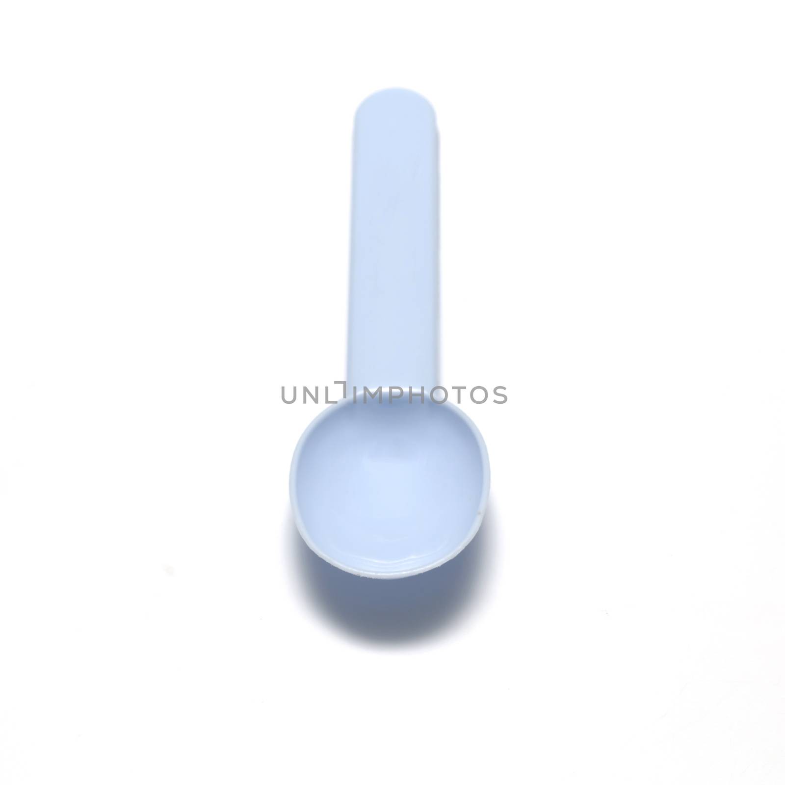 blue plastic spoon on a white background