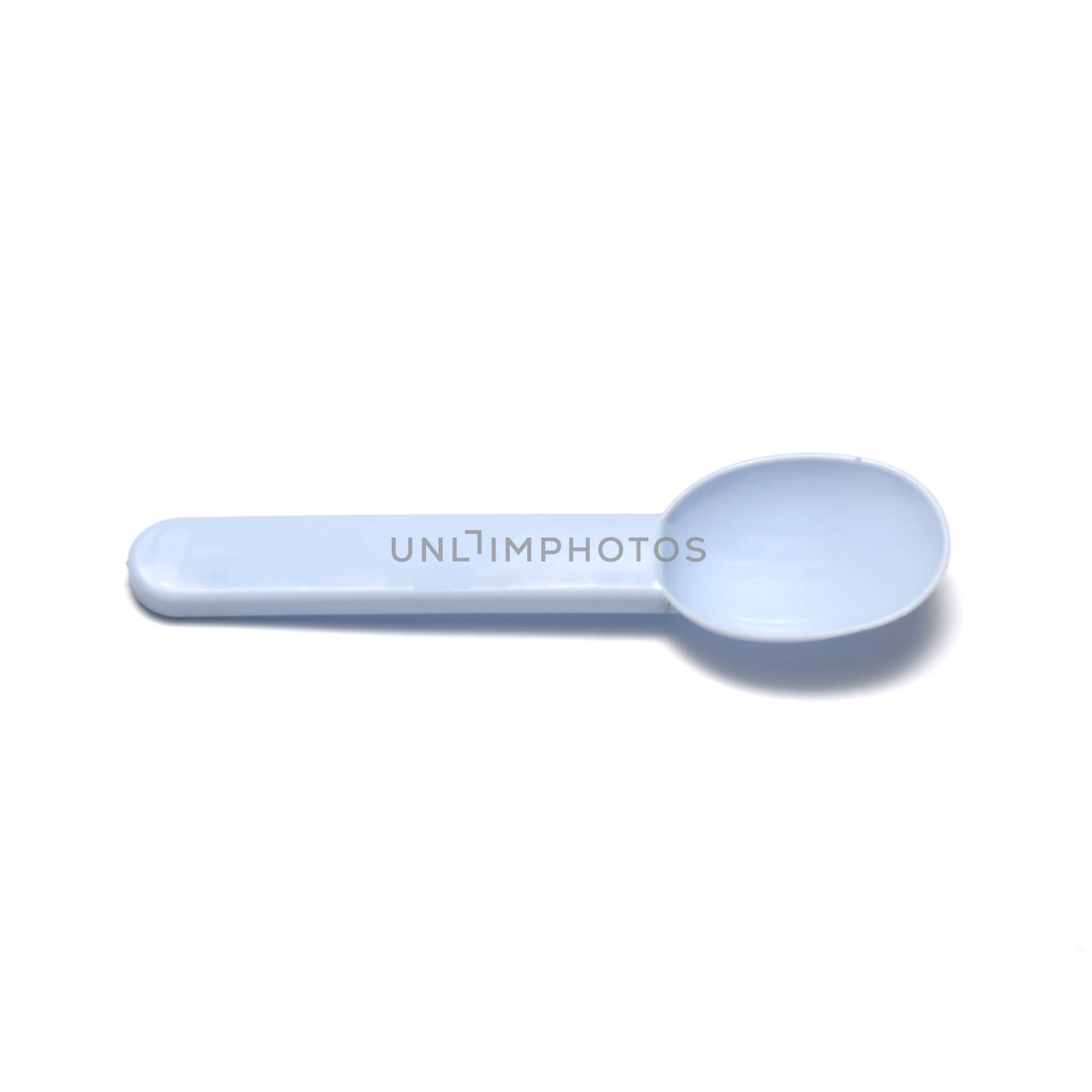 blue plastic spoon on a white background