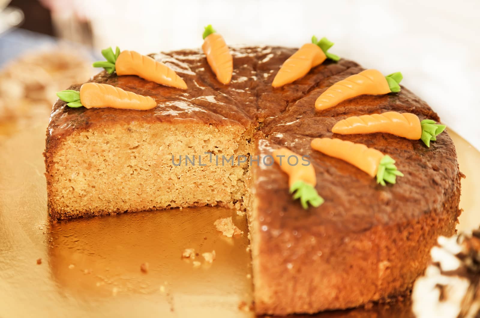 Carrot cake decorated with carrots on the top by RawGroup