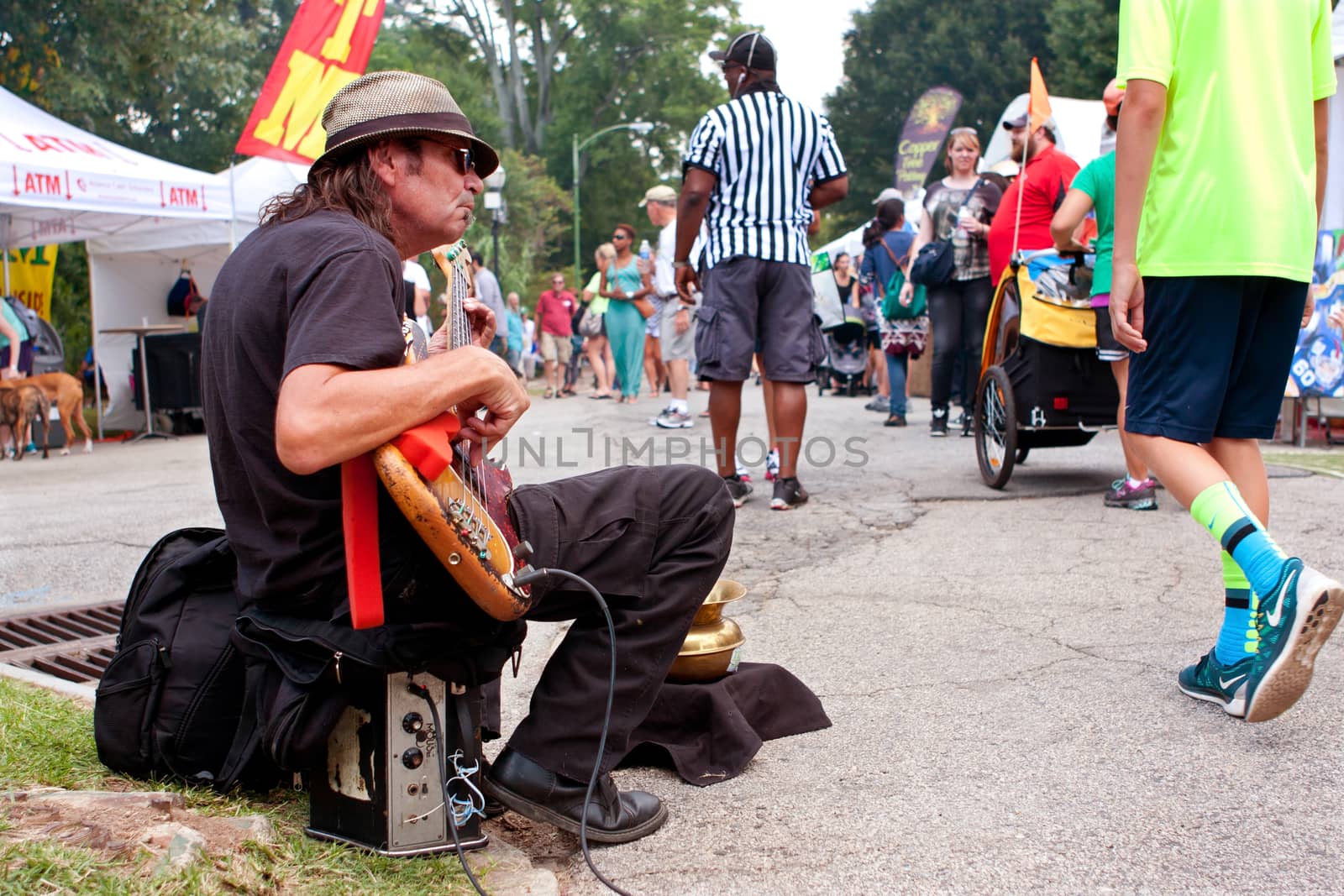 Man Strums Bass Guitar For Tips At Arts Festival by BluIz60