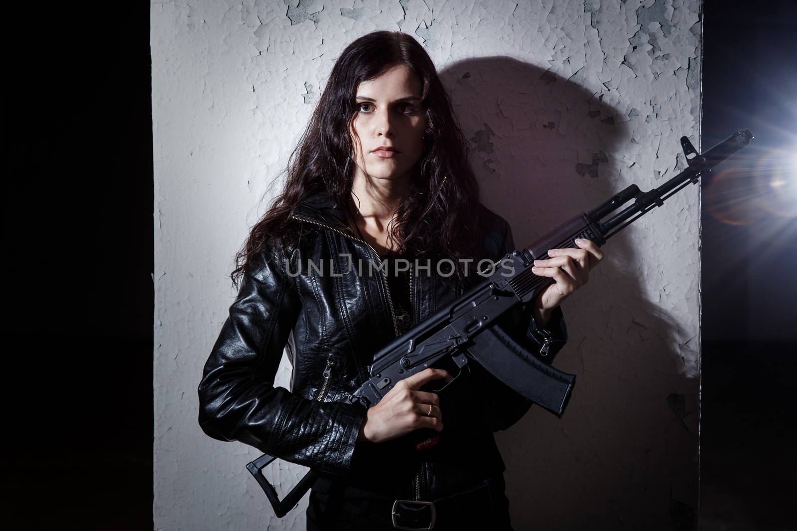 War, conflict. Female soldier with a gun