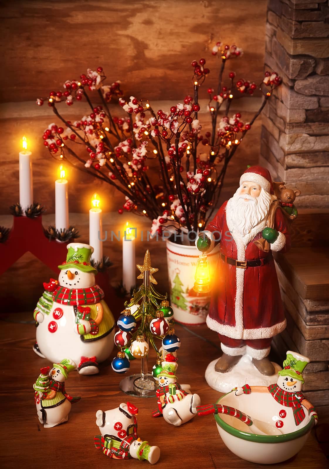 Figures of porcelain snowmen, Father Frost and a fir-tree with toys on the shelf