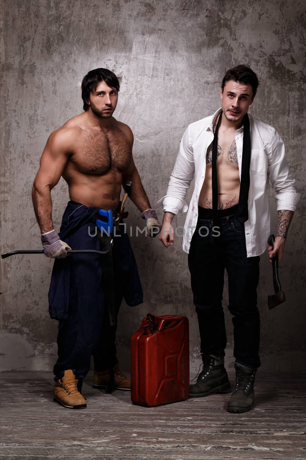 Strong and crazy men with construction tools