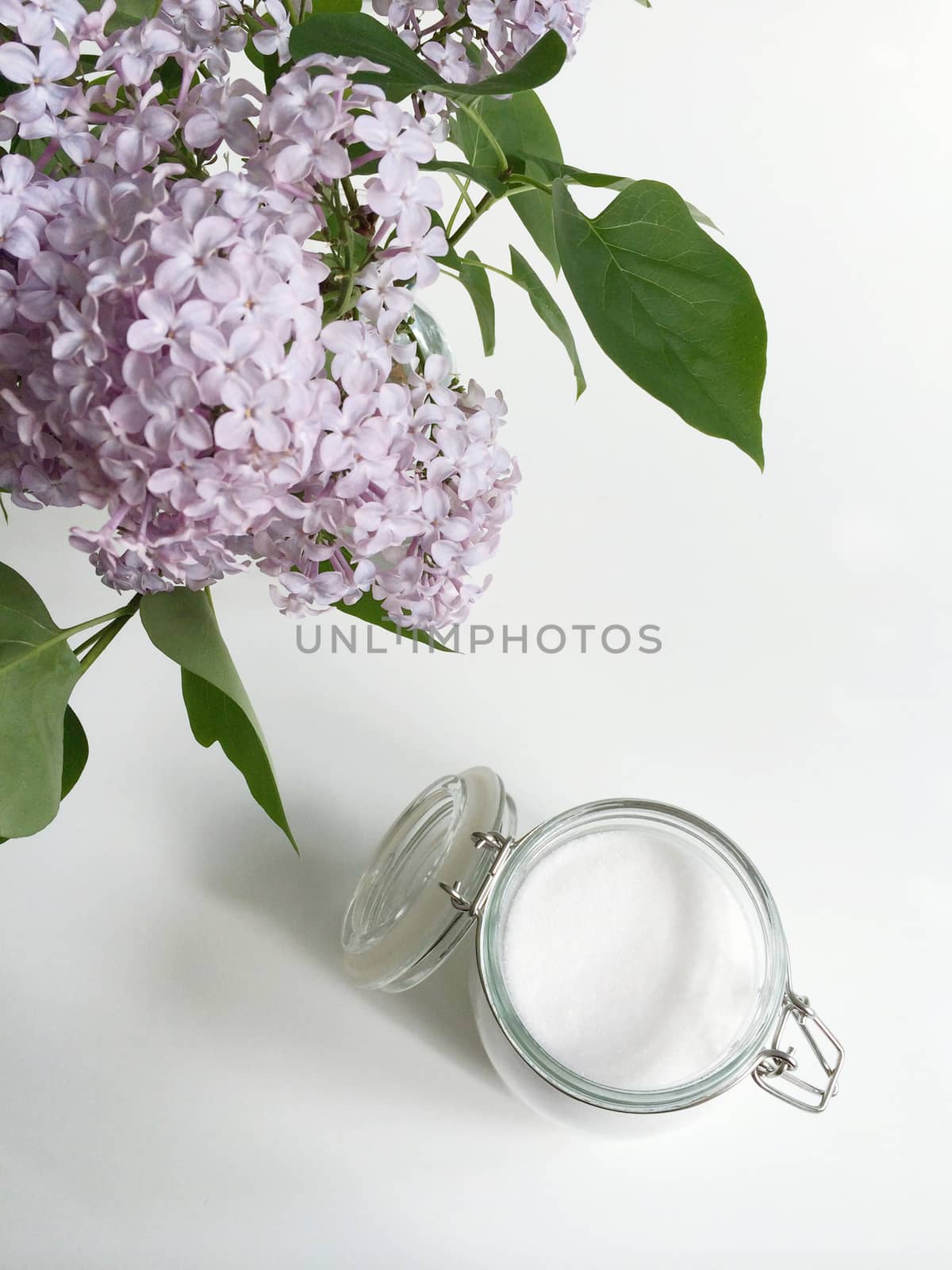 Glass jar of white sugar by mmm