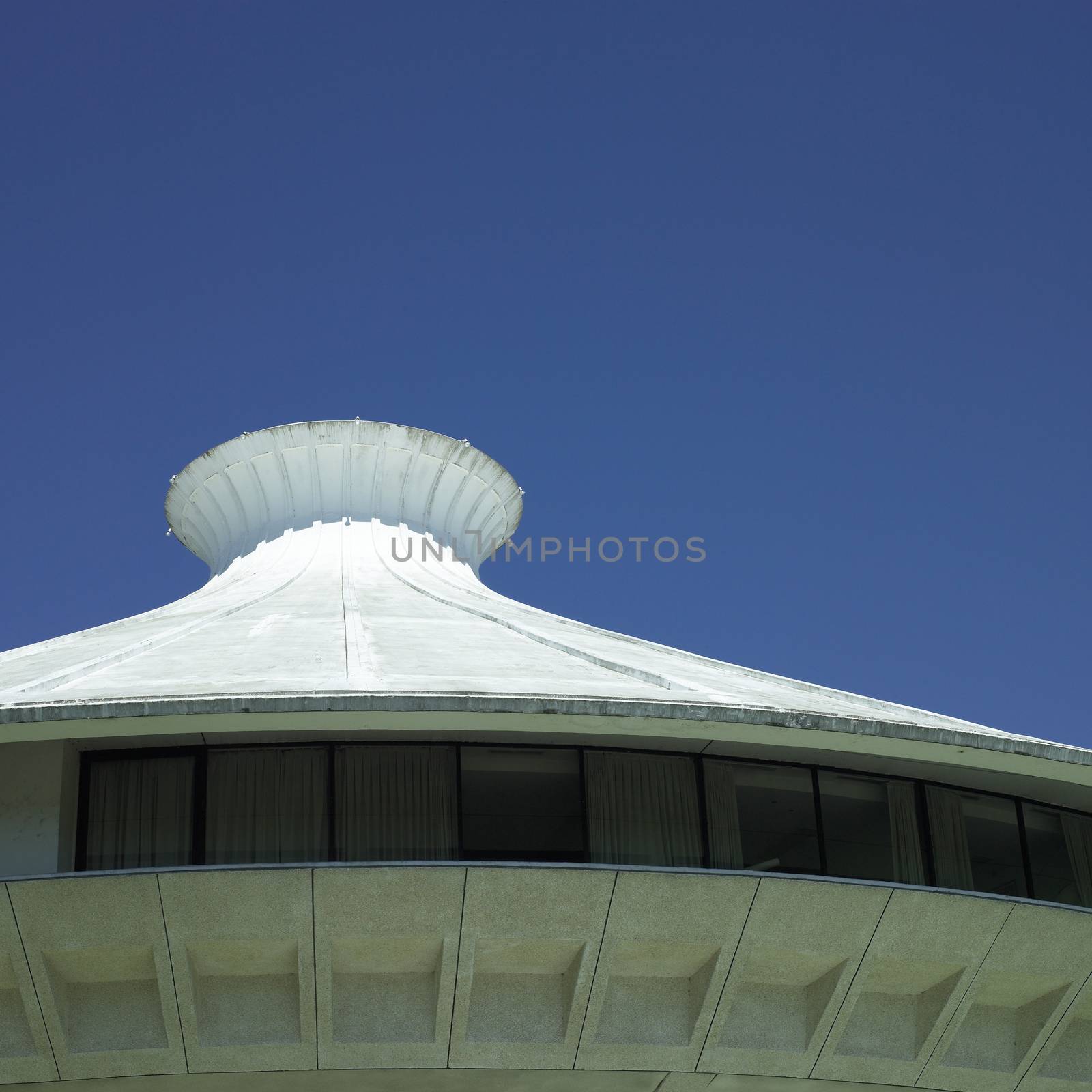 White cement building top and clear blue sky