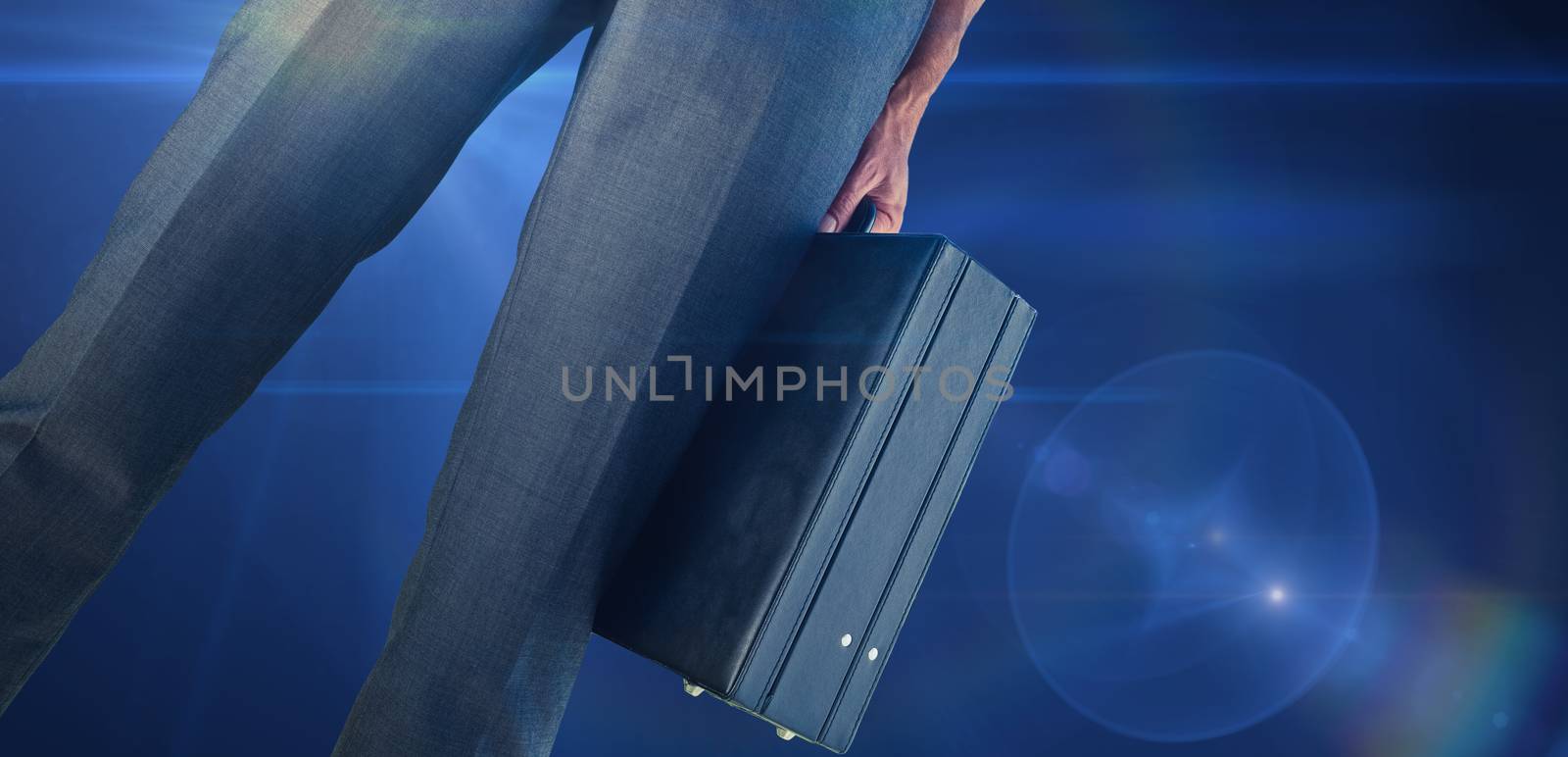 Composite image of businessman holding briefcase by Wavebreakmedia