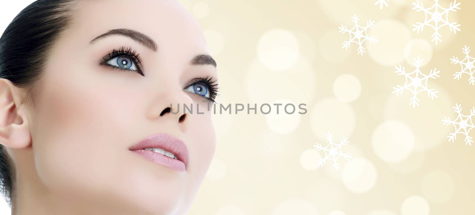Pretty woman against an abstract background with snowflakes by Nobilior