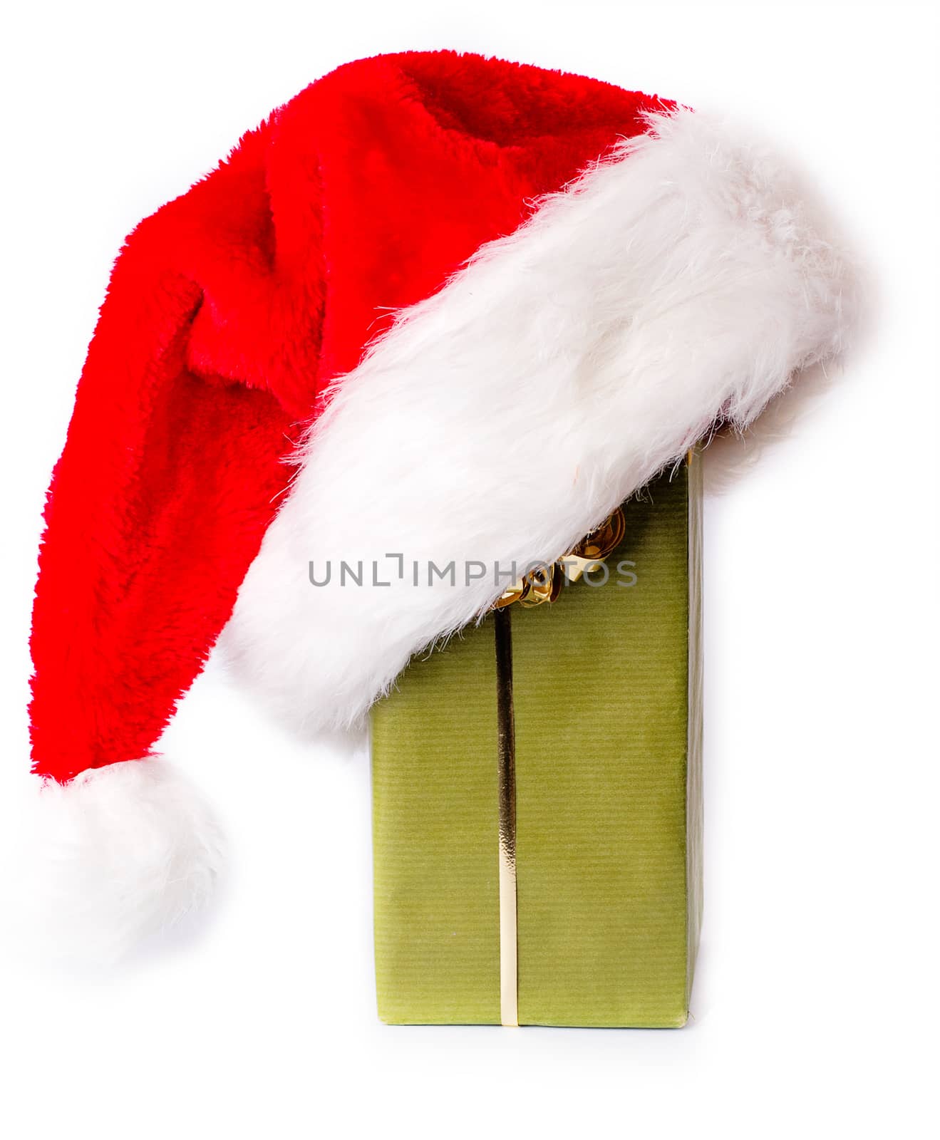 Santa hat is put on a gift box
