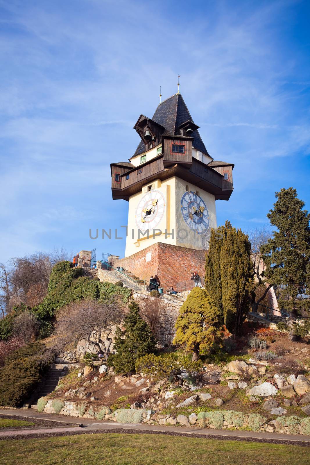 Graz, Austria - January 16, 2011: Tourists visiting Uhrturm old clock tower in Graz, Styria, Austria