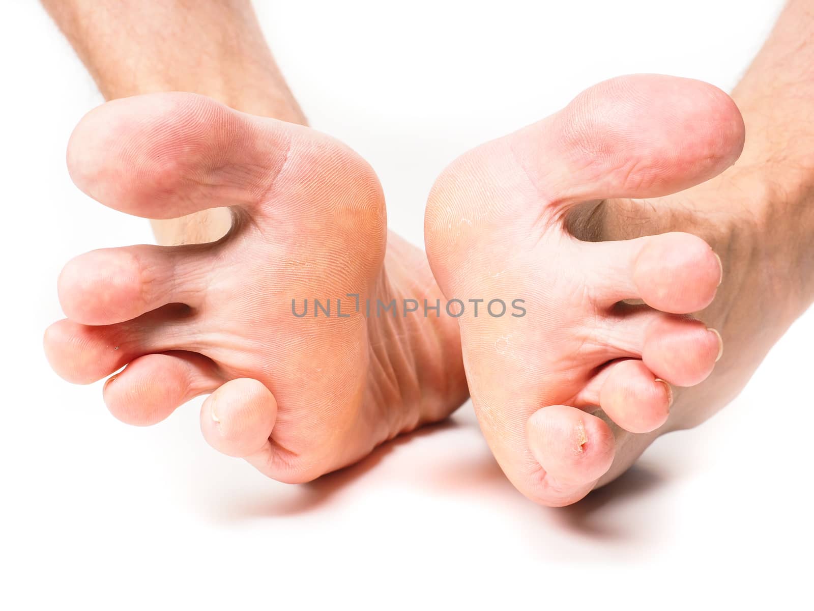 Male person spreading toes towards white background