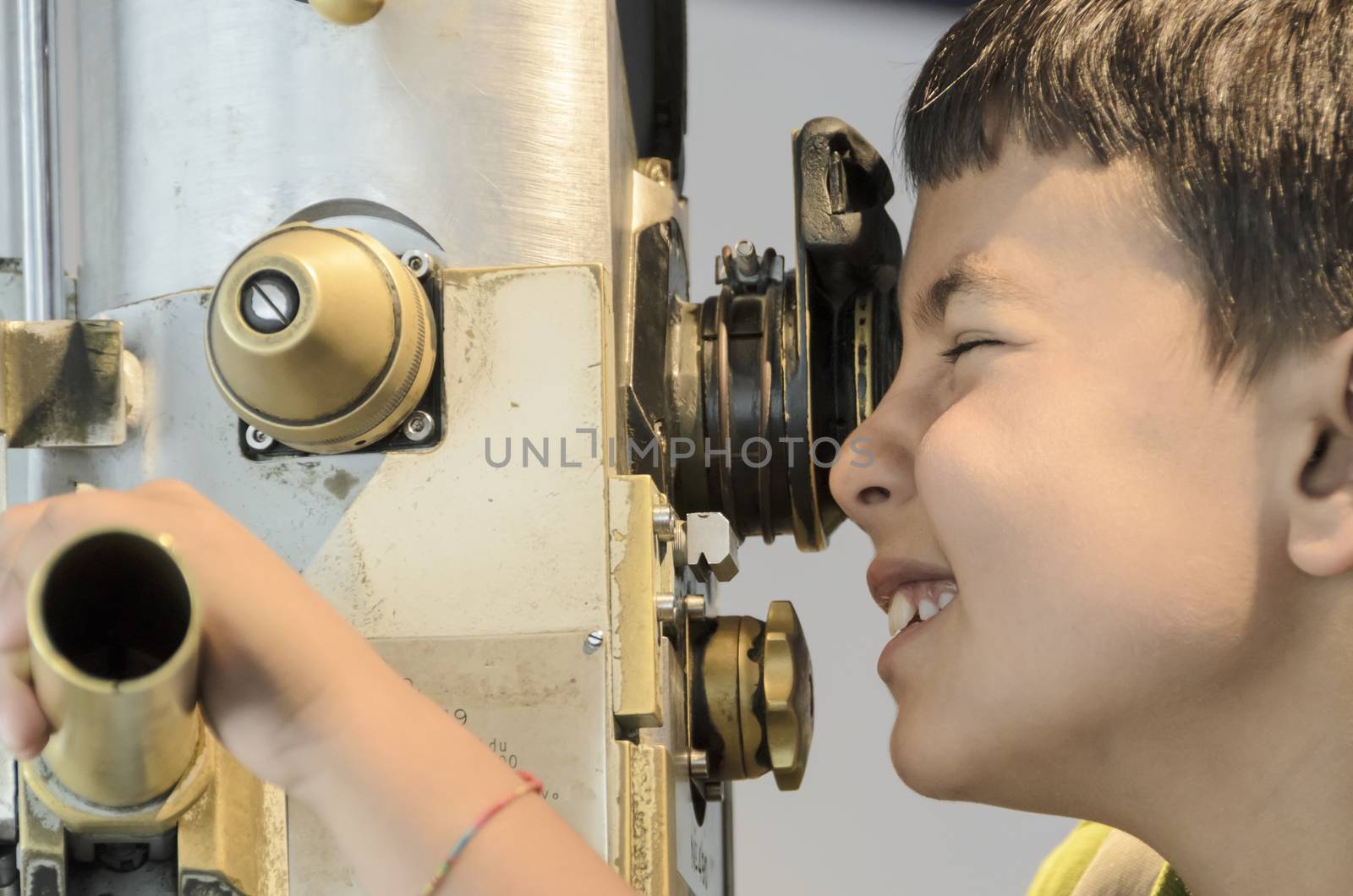 Curious child looking through the periscope the external environment.