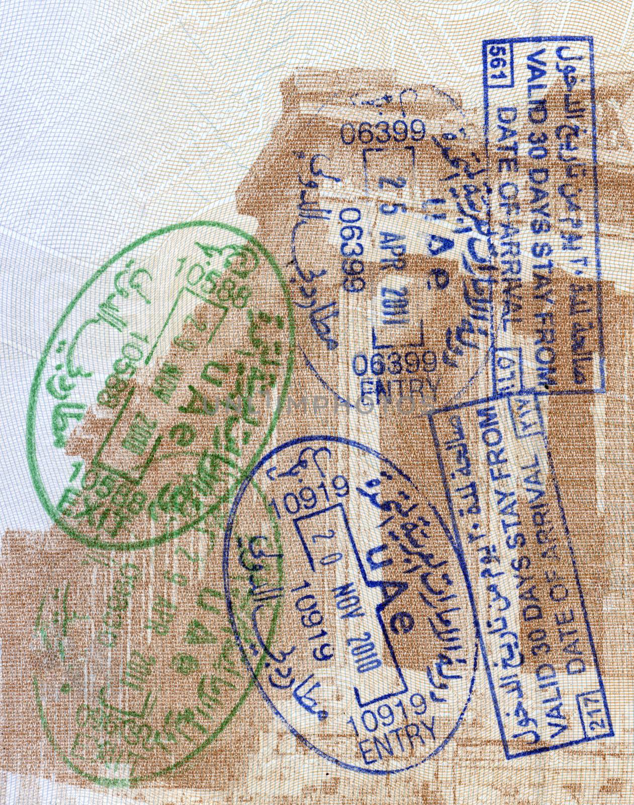 Background of passport stamps closeup by Portokalis
