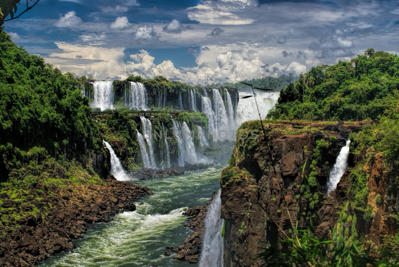 Dramatic view of Iguazu waterfalls in Argentina with stormy clouds in the background         