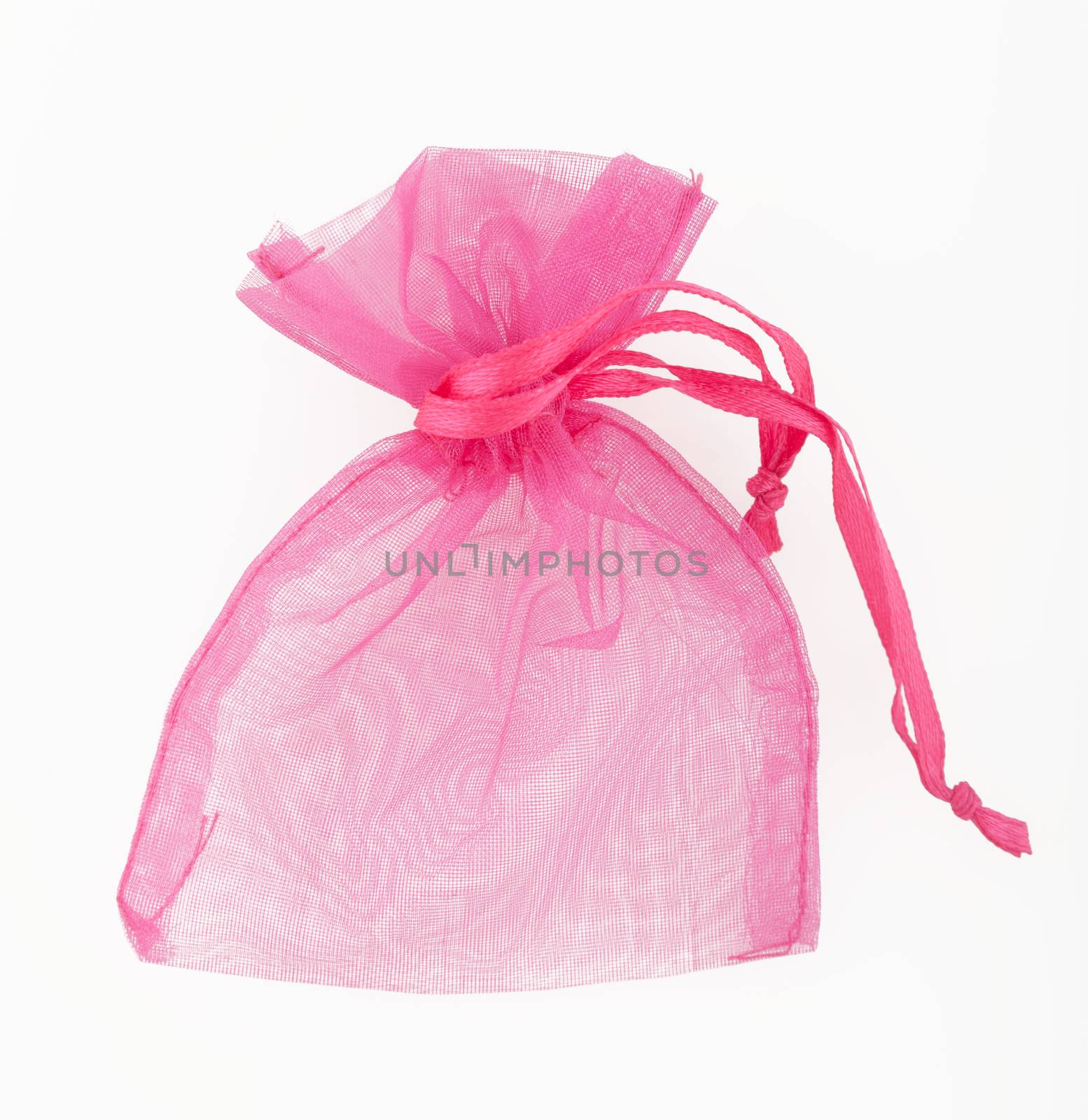Small transparent gift bag in pink color on white background
